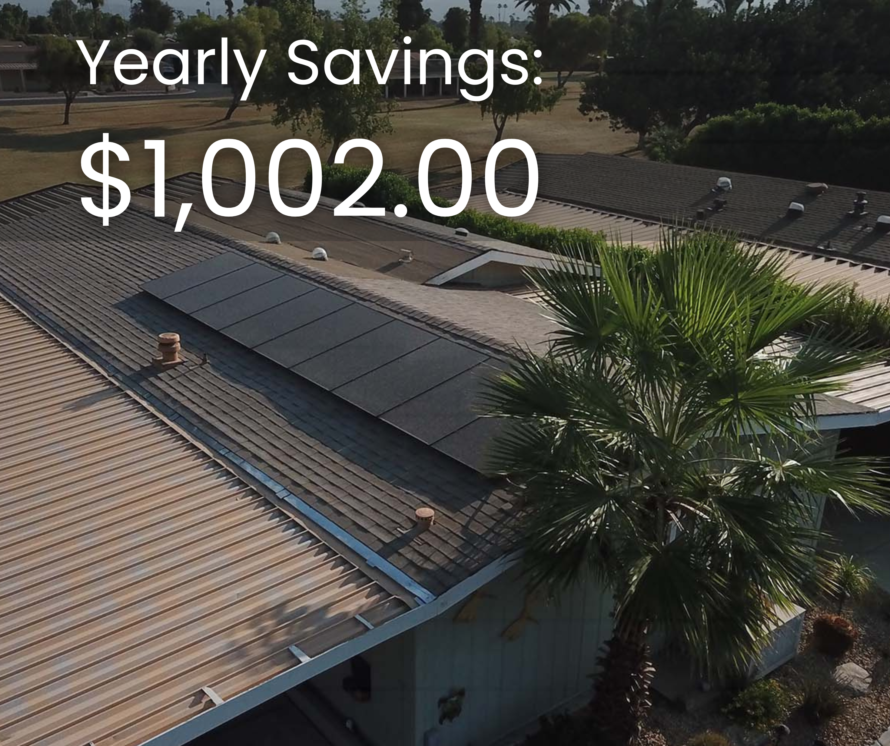 Yearly savings of $1,002.00 displayed on a roof with solar panels, surrounded by palm trees and a residential setting, emphasizing solar energy benefits for mobile homes.